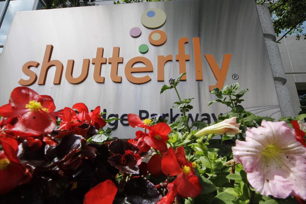 FILE - This April 26, 2012, file photo shows the Shutterfly headquarters in Redwood City, Calif. Private equity firm Apollo Global Management is buying online photo publishing company Shutterfly for $51 per share. Redwood City, California-based Shutterfly's stock closed at $50.25 on Monday, June 10, 2019. (AP Photo/Paul Sakuma, File)
