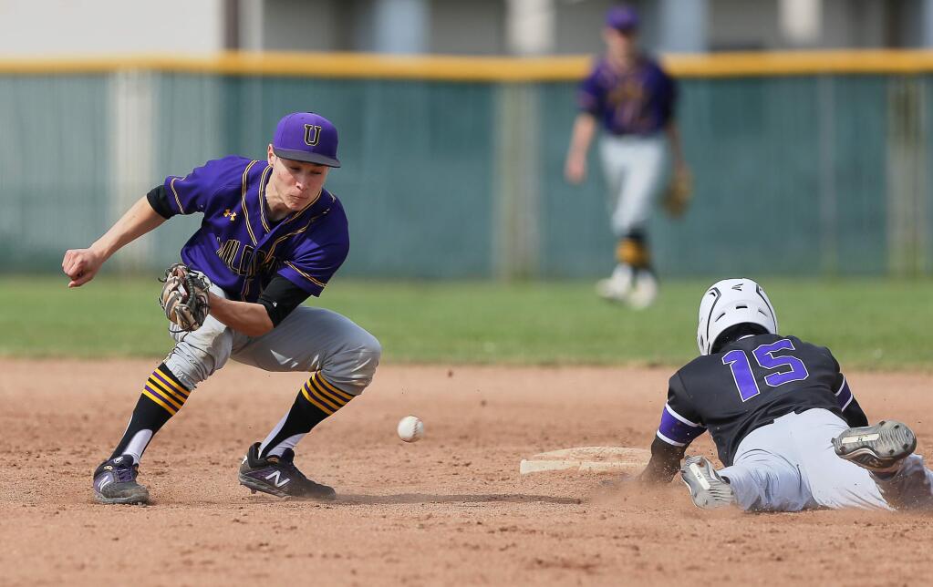 Ukiah's Adrian Villalpondo is unable to handle the throw to second as Sequioia's Andre Pereira safely tags the base, during the A.L. Rabinovitz Tournament in Santa Rosa on Tuesday, March 19, 2019. (Christopher Chung / The Press Democrat)