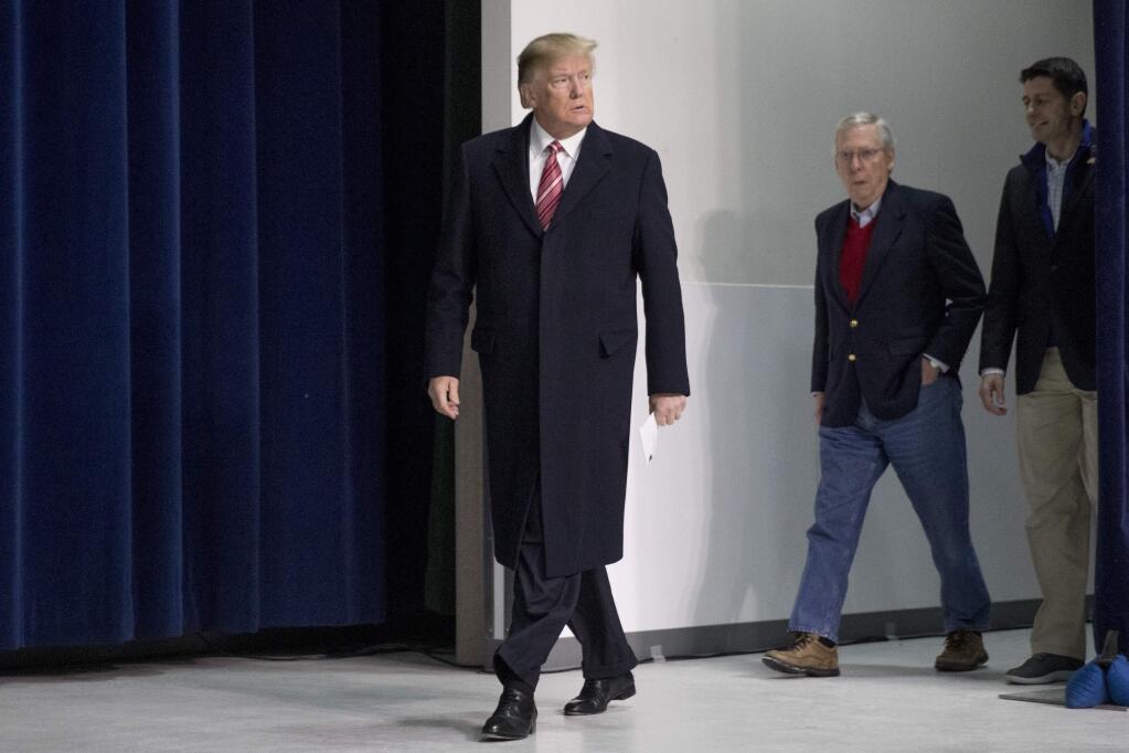 President Donald Trump, left, accompanied by Senate Majority Leader Mitch McConnell of Ky., second from right, and House Speaker Paul Ryan of Wis., right, arrives for a news conference after participating in a Congressional Republican Leadership Retreat at Camp David, Md., Saturday, Jan. 6, 2018. (AP Photo/Andrew Harnik)