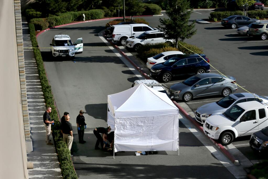 Members of the Sonoma County Sheriff's Office investigate a death just outside the parking garage at the Graton Resort and Casino in Rohnert Park on Monday, Sept. 9, 2019. (BETH SCHLANKER/ PD)