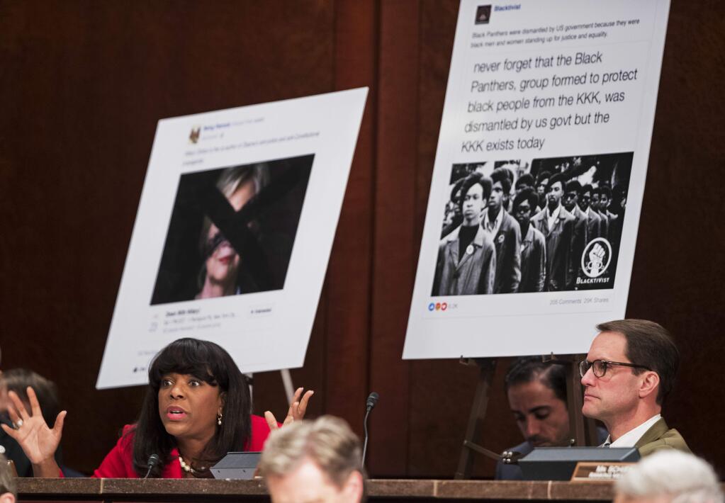 Rep. Terri Sewell, D-Ala., left, with Rep. Jim Himes, D-Conn., right, questions Facebook's General Counsel Colin Stretch, Twitter's Acting General Counsel Sean Edgett, and Google's Senior Vice President and General Counsel Kent Walker, about the Russian ads during a House Intelligence Committee task force hearing on Capitol Hill in Washington, Wednesday, Nov. 1, 2017. (AP Photo/Manuel Balce Ceneta)