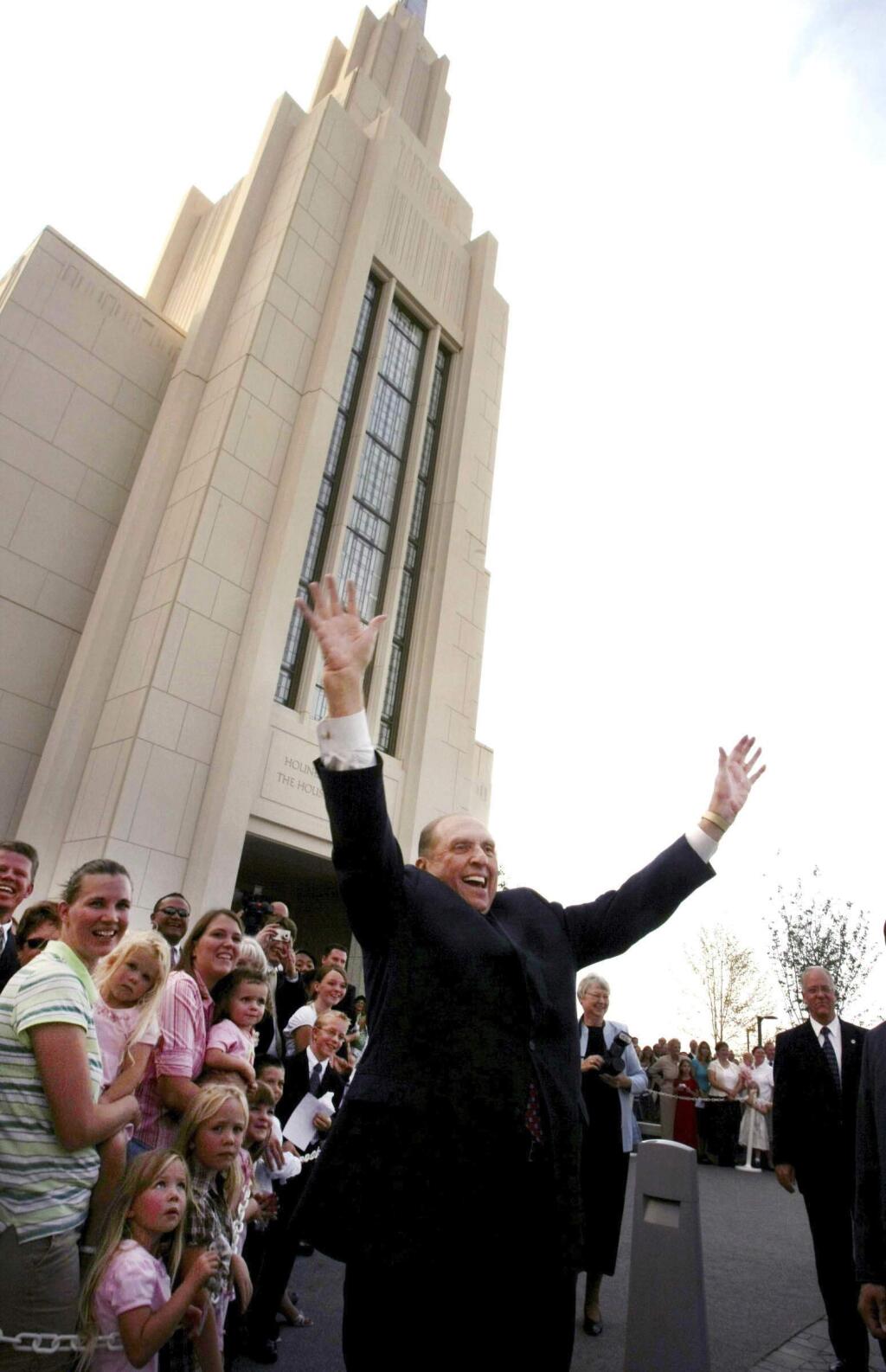 In this Aug. 24, 2008 photo, President Thomas S. Monson waves as he is leaving Twin Falls Temple in Twin Falls, Idaho. Aug. 24, 2008. Monson, the 16th president of the Mormon church, died Tuesday, Jan. 2, 2018, after overseeing the religion for nearly a decade. He was 90. (Scott G. Winterton/The Deseret News via AP)