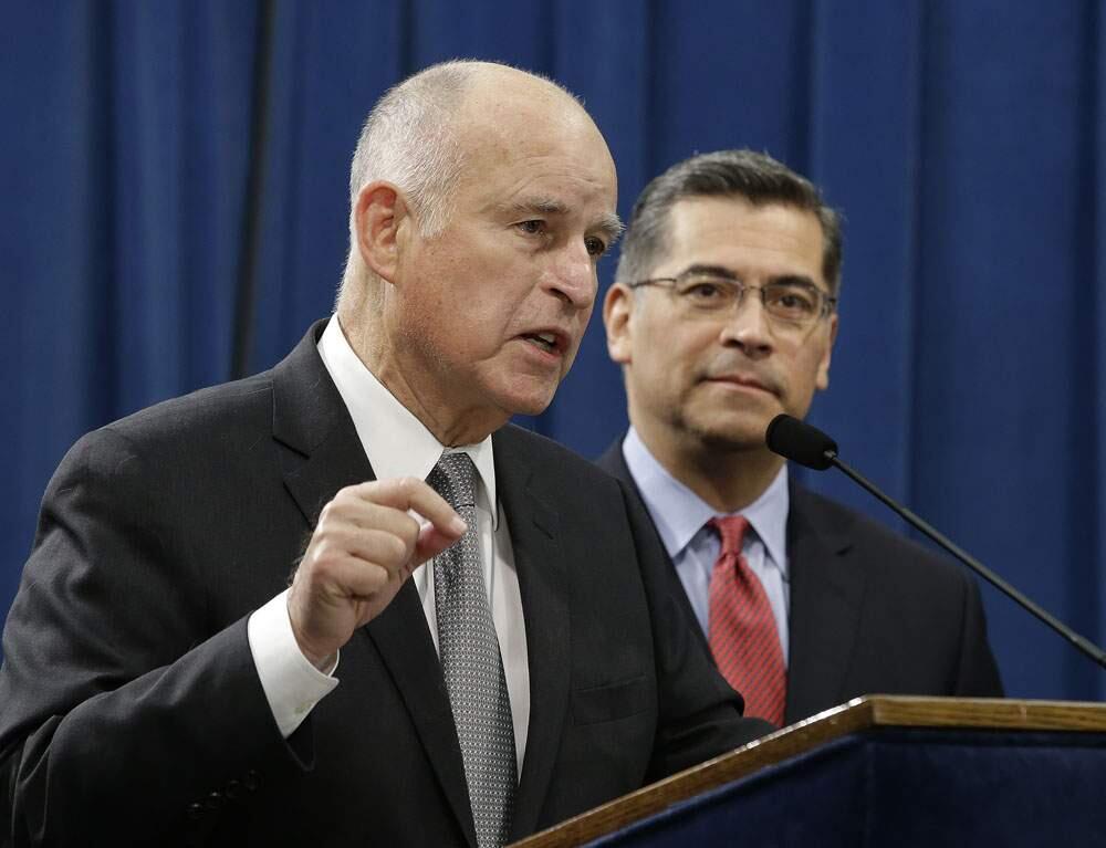 FILE photo: California Gov. Jerry Brown, left, speaks in Sacramento, Calif on March 7, 2018. (AP Photo/Rich Pedroncelli)