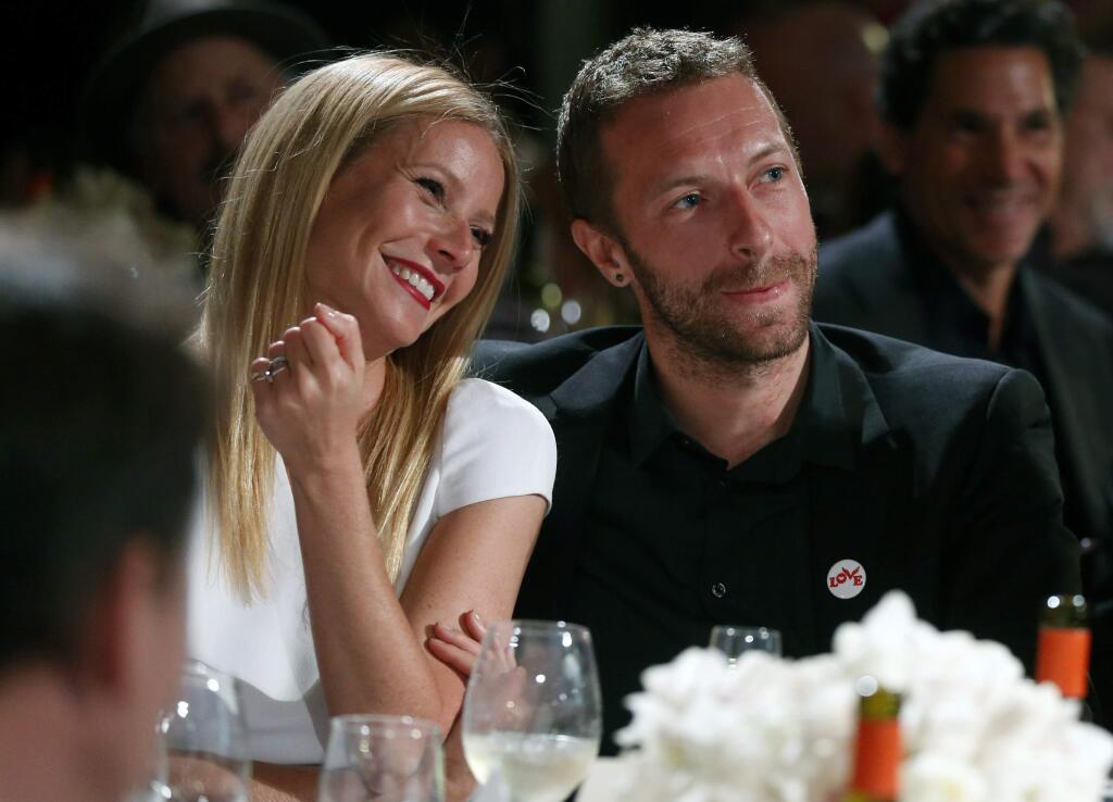 FILE - This Jan. 11, 2014 file photo shows actress Gwyneth Paltrow, left, and her husband, singer Chris Martin at the 3rd Annual Sean Penn & Friends Help Haiti Home Gala in Beverly Hills, Calif. Paltrow filed for divorce on Monday April 20, 2015, in Los Angeles, citing irreconcilable differences and seeks joint physical and legal custody of her two children with Martin. (Photo by Colin Young-Wolff /Invision/AP, File)