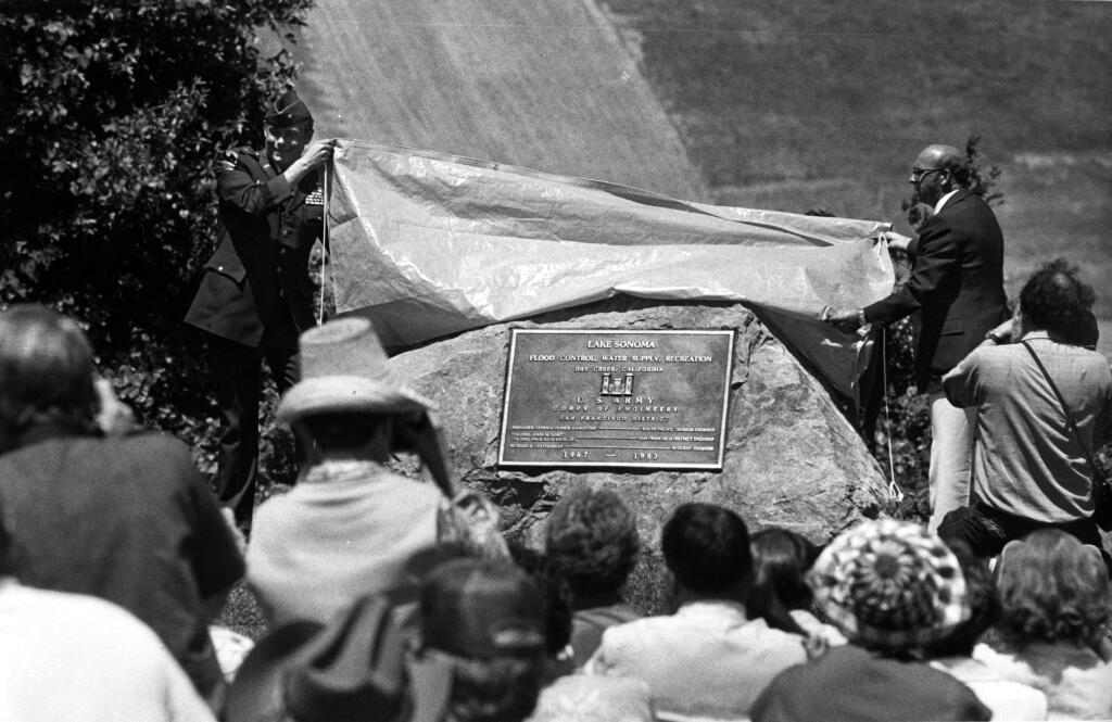Nick Esposti, right, and Homer Johnstone unveil a marker at Lake Sonoma. (PD FILE)