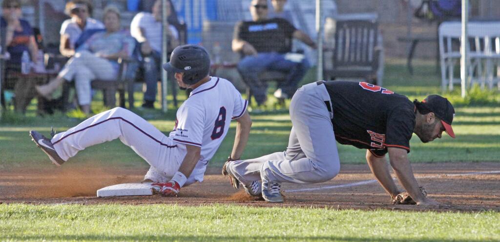 Bill Hoban/Index-TribuneStompers' Yuki Yasuda slides safely into third base in a recent game against Pittsburg. The Stompers open a three-game series against the Diamonds tonight, Friday, at Arnold Field.