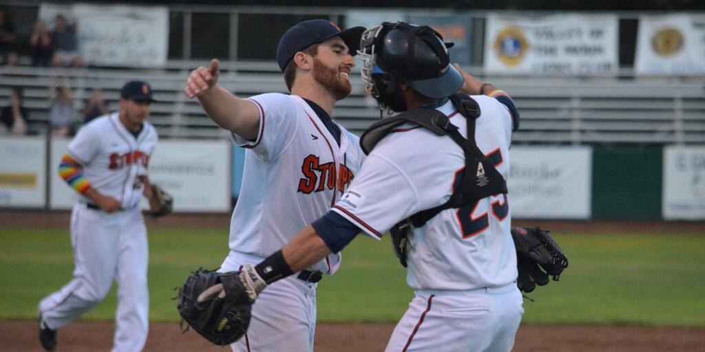 Sonoma Stompers pitcher Sean Conroy is embraced by catcher Isaac Wenrich following last year's historic 'Pride Night' shutout performance. (Courtesy Sonoma Stompers)