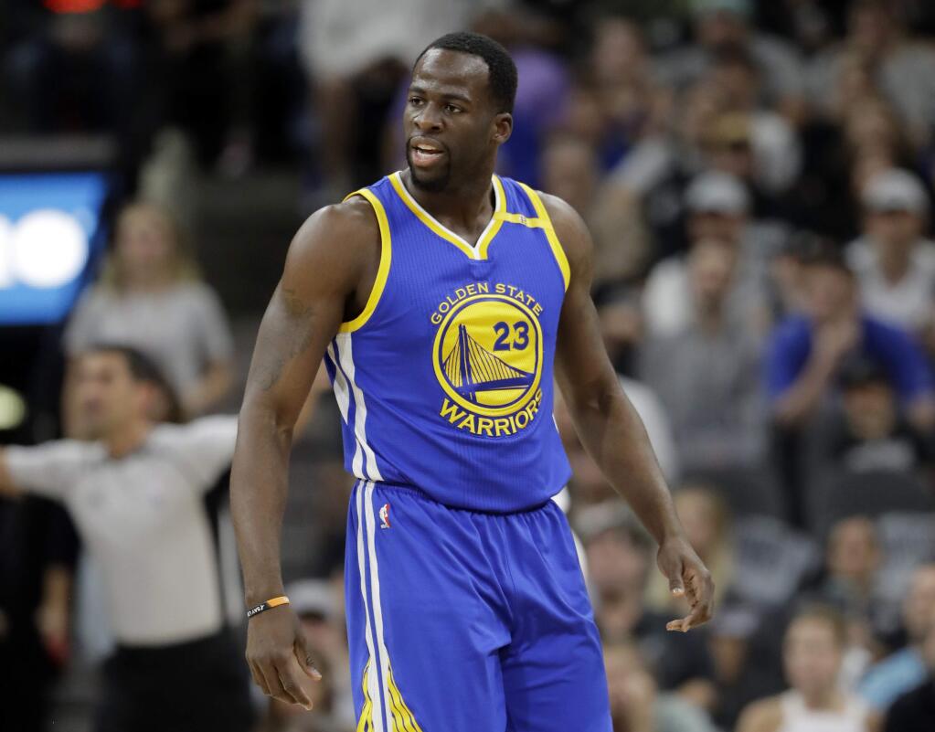 In this May 22, 2017, file photo, the Golden State Warriors' Draymond Green reacts to play against the San Antonio Spurs during Game 4 of the NBA Western Conference finals, in San Antonio. Green has been sued by a couple who claim the player and his entourage bullied them and physically assaulted them last year. (AP Photo/Eric Gay, File)