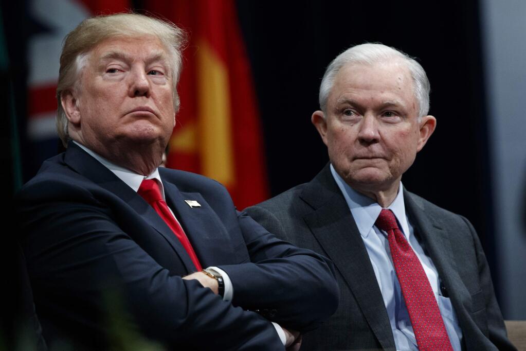 FILE - In this Dec. 15, 2017 file photo, President Donald Trump, left, sits with Attorney General Jeff Sessions during the FBI National Academy graduation ceremony in Quantico, Va. The Trump administration on Tuesday, Jan. 16, 2018, appealed a judge's ruling temporarily blocking its decision to end protections for hundreds of thousands of young immigrants and announced plans to seek U.S. Supreme Court review even before the appeals court issues a decision. Sessions said in a statement that it defied ' law and common sense' for a single federal judge to decide the Deferred Action for Childhood Arrivals issue. (AP Photo/Evan Vucci, File)