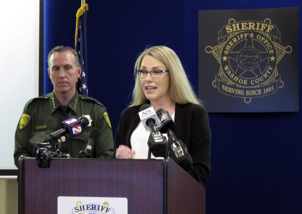Genetic genealogist Cheryl Hester speaks at a news conference with Washoe County Sheriff Darin Balaam in the background in Reno, Nev., Tuesday, May 7, 2019, about new DNA evidence that has determined the woman whose body was found near a hiking trail in 1982 was killed by a man who committed suicide in jail a year later after confessing to three other murders in California. (AP Photo/Scott Sonner)