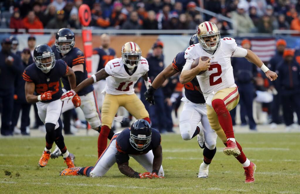 San Francisco 49ers quarterback Blaine Gabbert (2) runs to the end zone for a touchdown during the second half of an NFL football game against the Chicago Bears, Sunday, Dec. 6, 2015, in Chicago. (AP Photo/Charles Rex Arbogast)