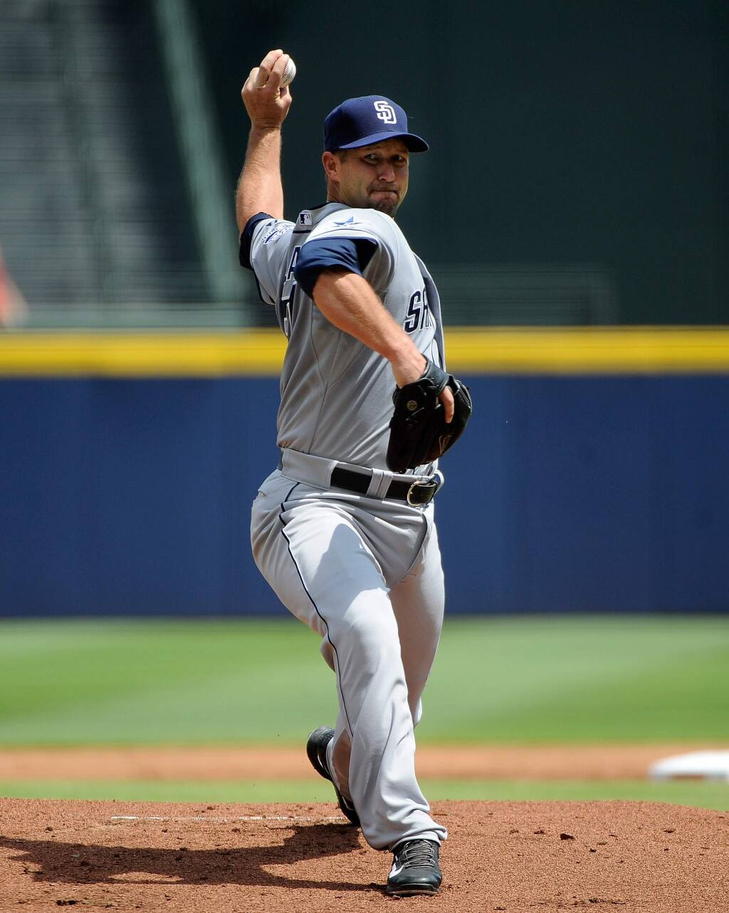 San Diego Padres' Jason Lane delivers to the Atlanta Braves in his first outing as a Padres starting pitcher during the first inning of a baseball game Monday, July 28, 2014, in Atlanta. (AP Photo/David Tulis)