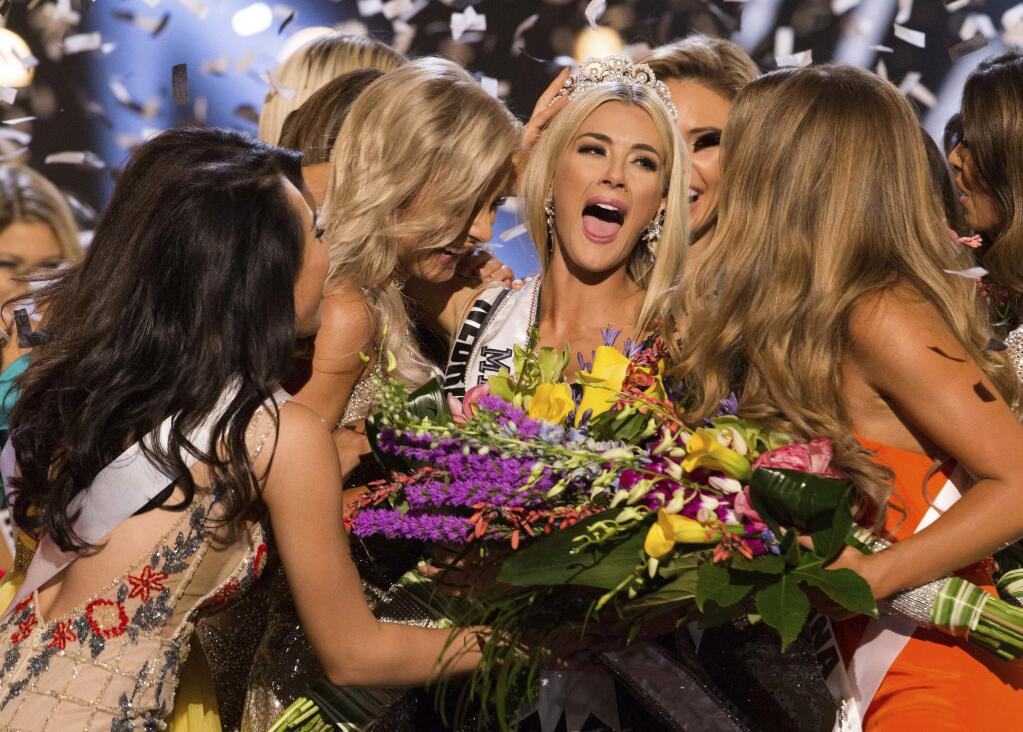 In this photo provided by The Miss Universe Organization, Sarah Rose Summers, Miss Nebraska USA 2018, is crowned Miss USA and congratulated by fellow contestants at the conclusion of the event, Monday, May 21, 2018, in Shreveport, La. (Brittany Elizabeth Strickland/The Miss Universe Organization via AP)