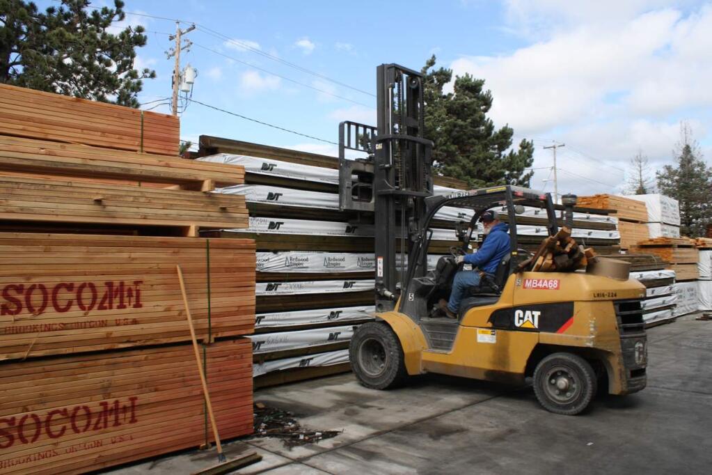 Burgess Lumber forklift operator Ron Fulton unloads high-demand lumber and other building materials at the company's yard at 3610 Copperhill Lane north of Santa Rosa on Oct. 2, 2018. (Gary Quackenbush / for North Bay Business Journal)