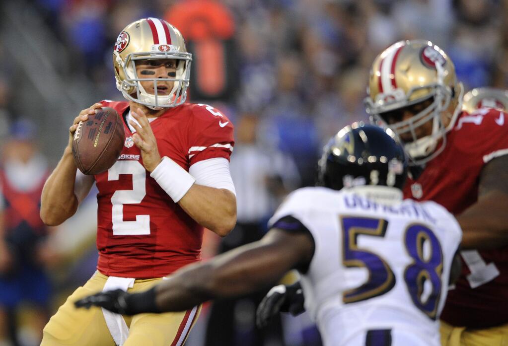 San Francisco 49ers quarterback Blaine Gabbert (2) looks for a receiver as he is pressured by Baltimore Ravens outside linebacker Elvis Dumervil (58) in the first half of an NFL preseason football game, Thursday, Aug. 7, 2014, in Baltimore. (AP Photo/Nick Wass)