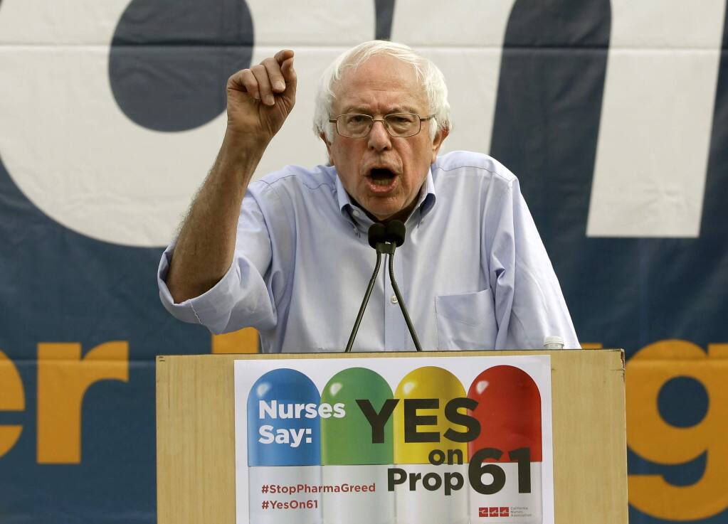 Former presidential candidate Sen. Bernie Sanders, of Vermont, speaks in support of Proposition 61 in Sacramento, Calif., Monday, Nov. 7, 2016. Proposition 61, if approved by voters Tuesday, would prohibit state agencies from paying more for prescription drugs than the U.S. Dept. of Veterans Affairs. (AP Photo/Rich Pedroncelli)