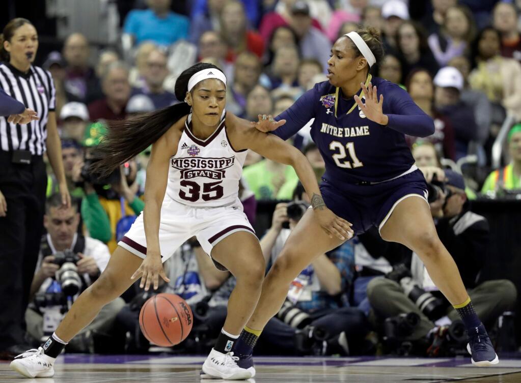 Mississippi State's Victoria Vivians (35) dribbles around Notre Dame's Kristina Nelson (21) during the first half in the final of the women's NCAA Final Four college basketball tournament, Sunday, April 1, 2018, in Columbus, Ohio. (AP Photo/Tony Dejak)