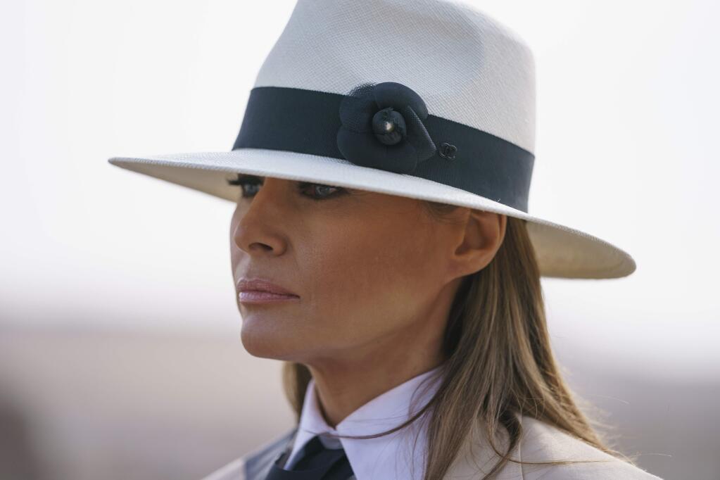In this Oct. 6, 2018 photo, First lady Melania Trump pauses as she speaks to media during a visit to the historical Giza Pyramids site near Cairo, Egypt. First lady Melania Trump says she thinks she's among the most bullied people in the world and there are people in the White House she and President Donald Trump can't trust. (AP Photo/Carolyn Kaster)