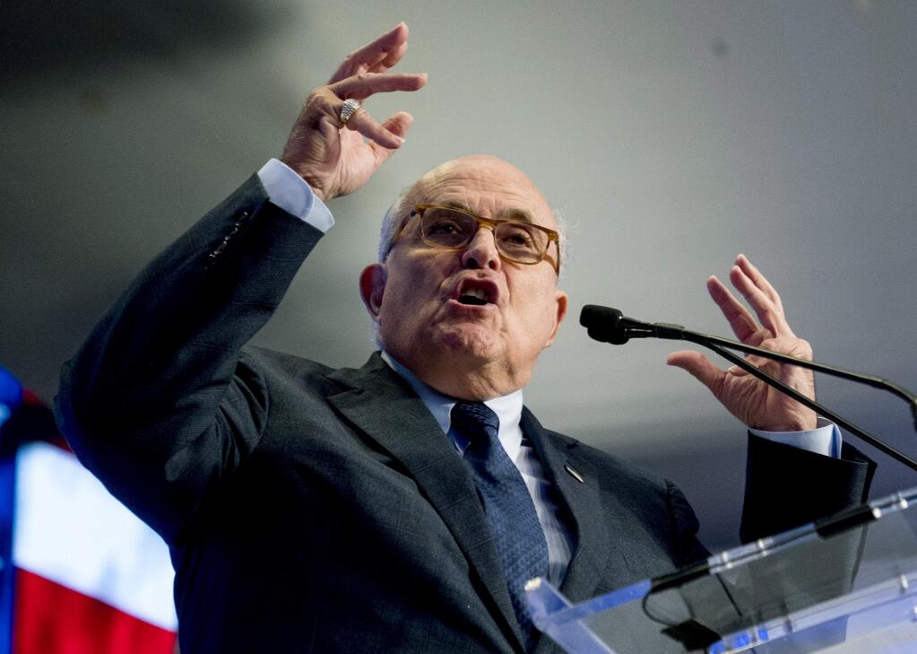 FILE - In this May 5, 2018, file photo, Rudy Giuliani, an attorney for President Donald Trump, speaks in Washington. Giuliani says he'd only cooperate with the House impeachment inquiry if his client agreed. Central to the investigation is the effort by Giuliani to have Ukraine conduct a corruption probe into Joe Biden and his son's dealings with a Ukrainian energy company. Trump echoed that request in a July 2019 call with Ukraine's president. The House Intelligence Committee is leading the inquiry, and Chairman Adam Schiff hasn't decided if he wants to hear from Giuliani. AP Photo/Andrew Harnik, File)