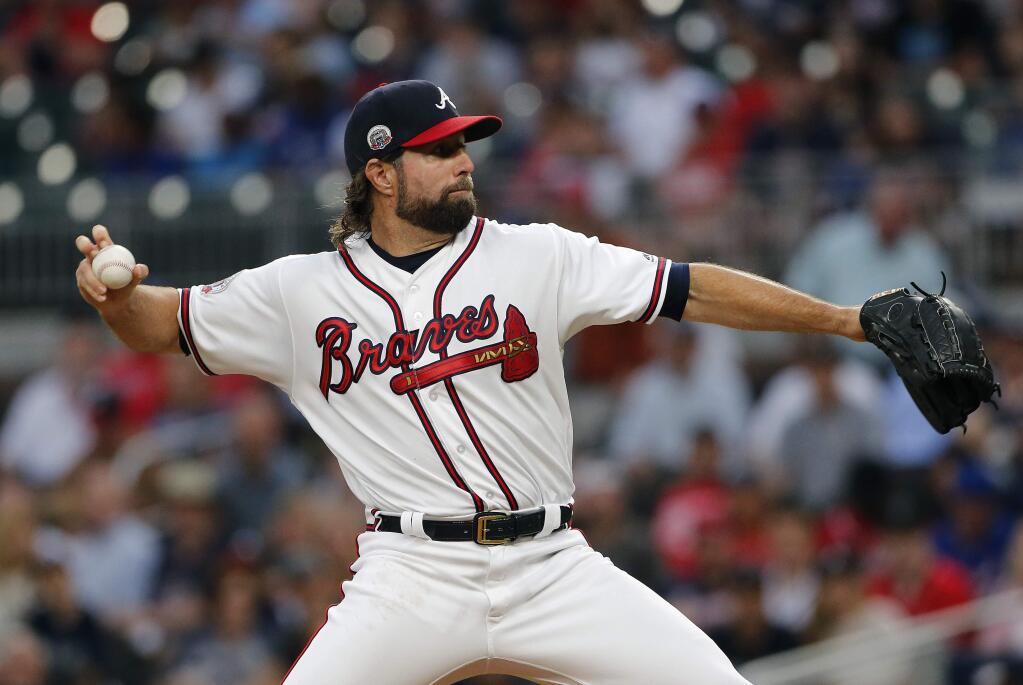 Atlanta Braves starting pitcher R.A. Dickey (19) works in the first inning of a baseball game against the San Francisco Giants, Monday, June 19, 2017, in Atlanta. (AP Photo/John Bazemore)