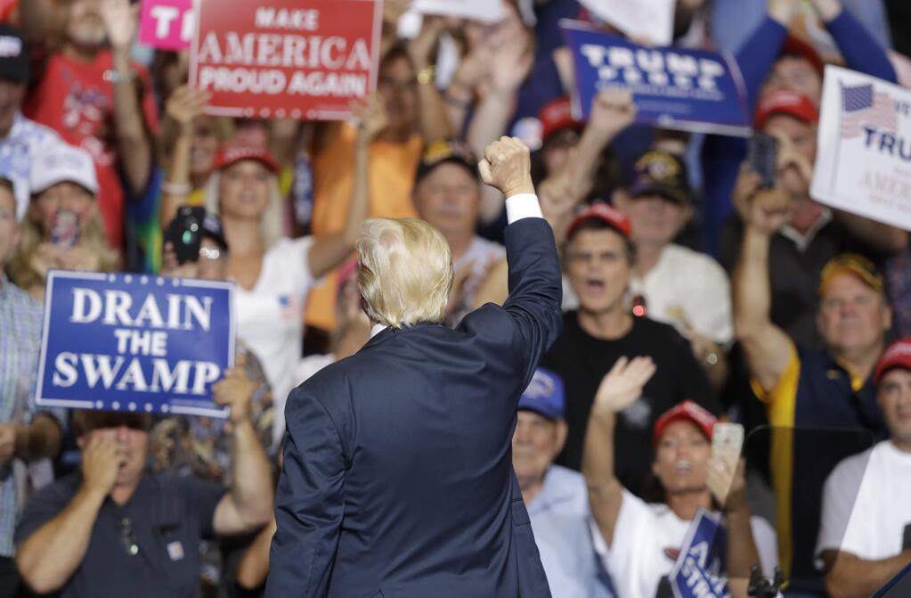 President Donald Trump reacts during a rally Thursday, Aug. 3, 2017, in Huntington, W.Va. (AP Photo/Darron Cummings)