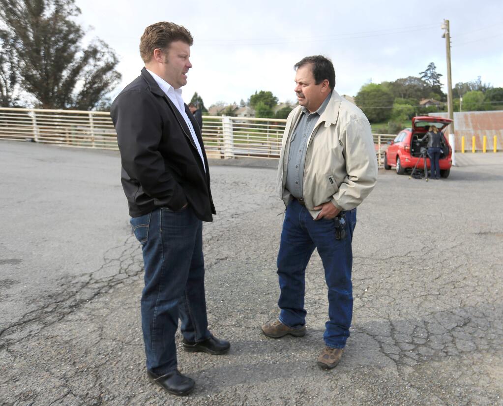 David Evans, owner of Marin Sun Farms. talks with Two Rock rancher Joe Pozzi, Friday March 29, 2014 prior to a press conference announcing the change of ownership of Rancho Feeding Corp. after Evans purchased the shuttered slaughterhouse Feb. 28 and plans to reopen April 7 as Marin Sun Farms Petaluma. (Kent Porter / Press Democrat) 2014