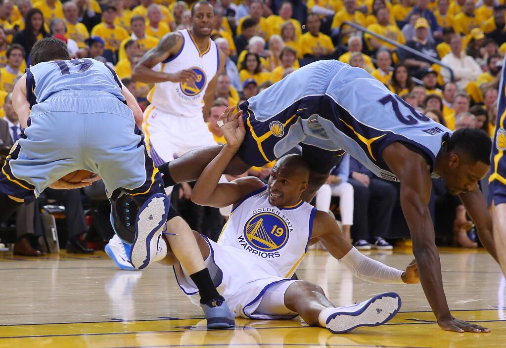 Golden State Warriors guard Leandro Barbosa tumbles with Memphis Grizzlies forward Jeff Green after losing the ball to guard Beno Udrih during Game 2 of the NBA Playoffs Western Conference Semifinals at Oracle Arena in Oakland on Tuesday, May 5, 2015. (Christopher Chung / The Press Democrat)