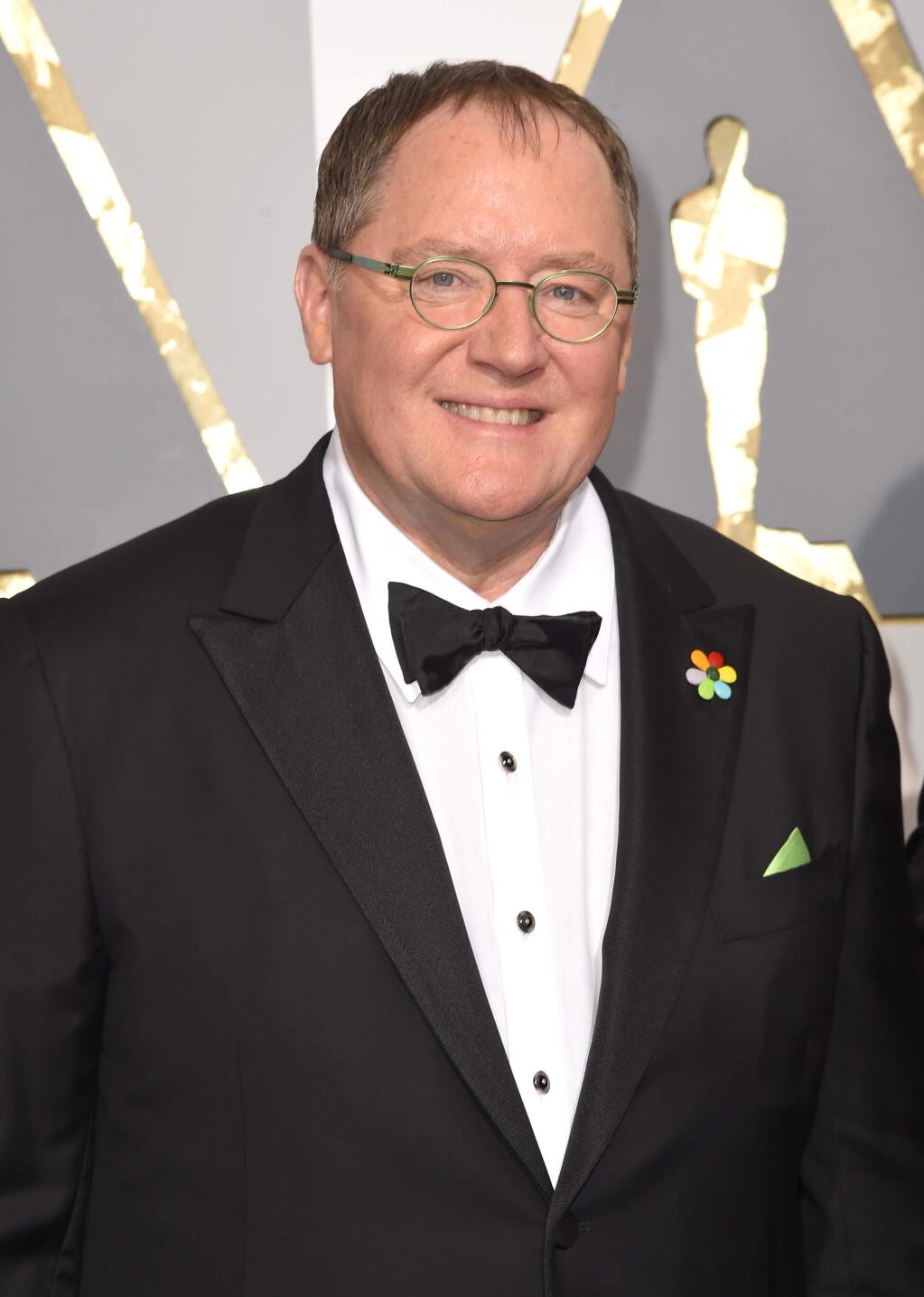 FILE - In this Feb. 28, 2016 file photo, Pixar co-founder and Walt Disney Animation chief John Lasseter arrives at the Oscars in Los Angeles. (Photo by Dan Steinberg/Invision/AP, File)