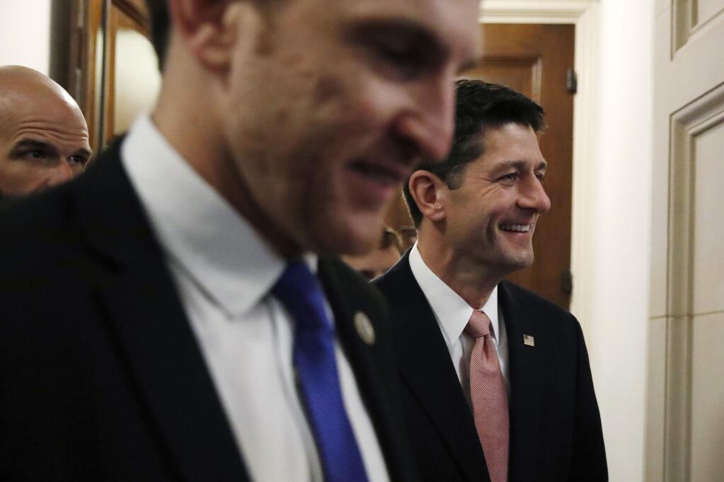 House Speaker Paul Ryan of Wis., right, leaves a GOP conference on taxes, Thursday, Nov. 2, 2017, on Capitol Hill in Washington. (AP Photo/Jacquelyn Martin)
