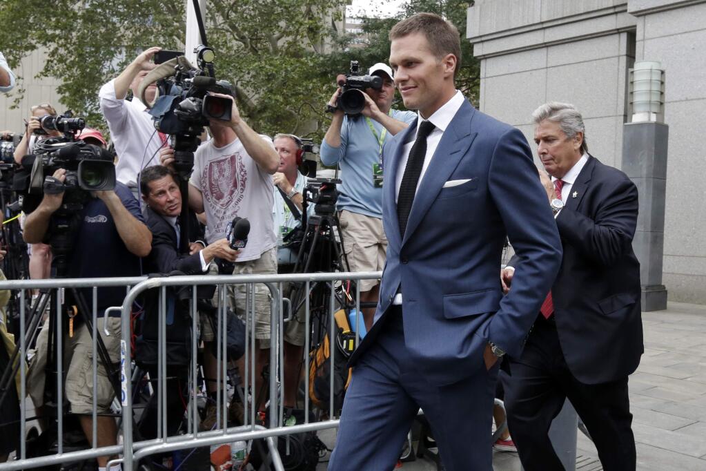 FILE - In this April 31, 2015, file photo, New England Patriots quarterback Tom Brady leaves Federal court in New York. Brady can suit up for his team's season opener after a judge erased his four-game suspension for 'Deflategate.' (AP Photo/Richard Drew, File)