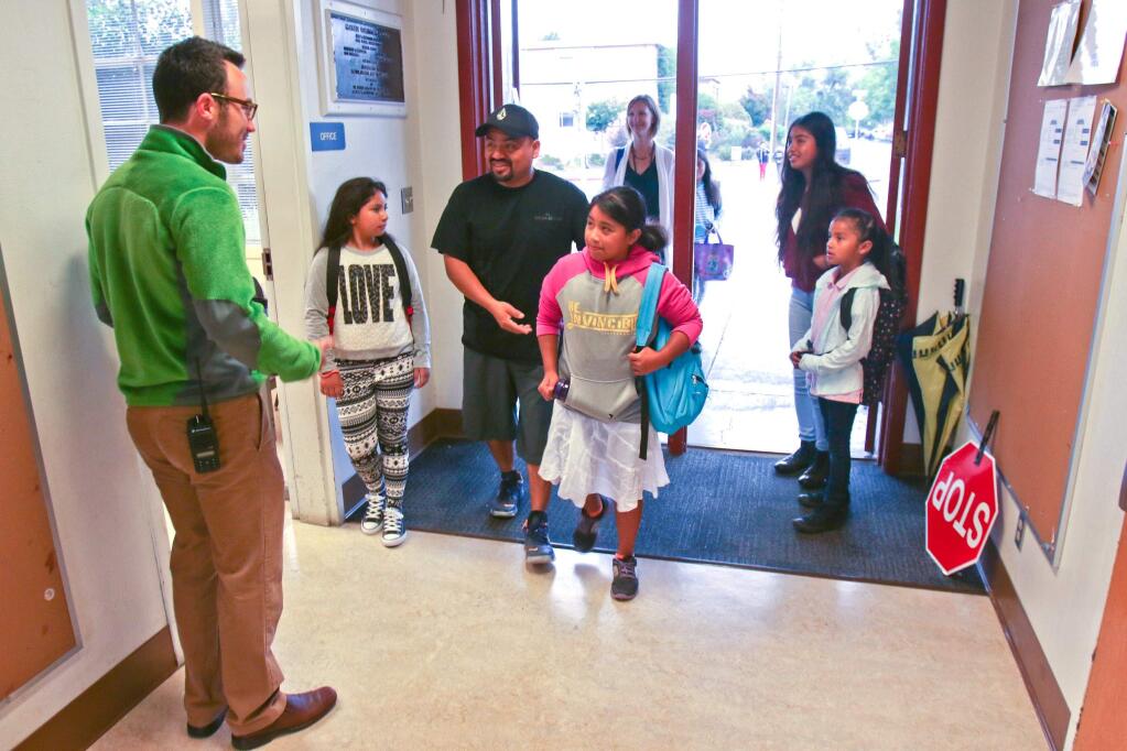 Principal Mike Taylor greets students on the first day of school at McKinley School in Petaluma on Wednesday August 19, 2015. (SCOTT MANCHESTER/ARGUS-COURIER STAFF)