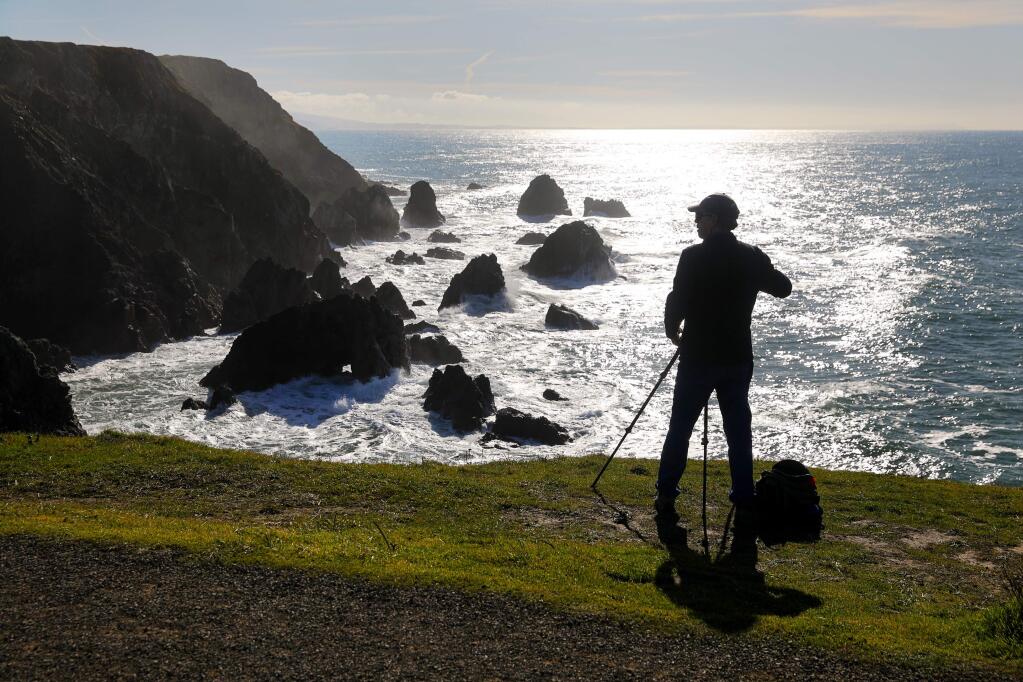 Jim Magill of Walnut Creek prepares to take scenic photos of the coastline at Bodega Head on Friday, Jan. 10, 2020. (CHRISTOPHER CHUNG/ PD)