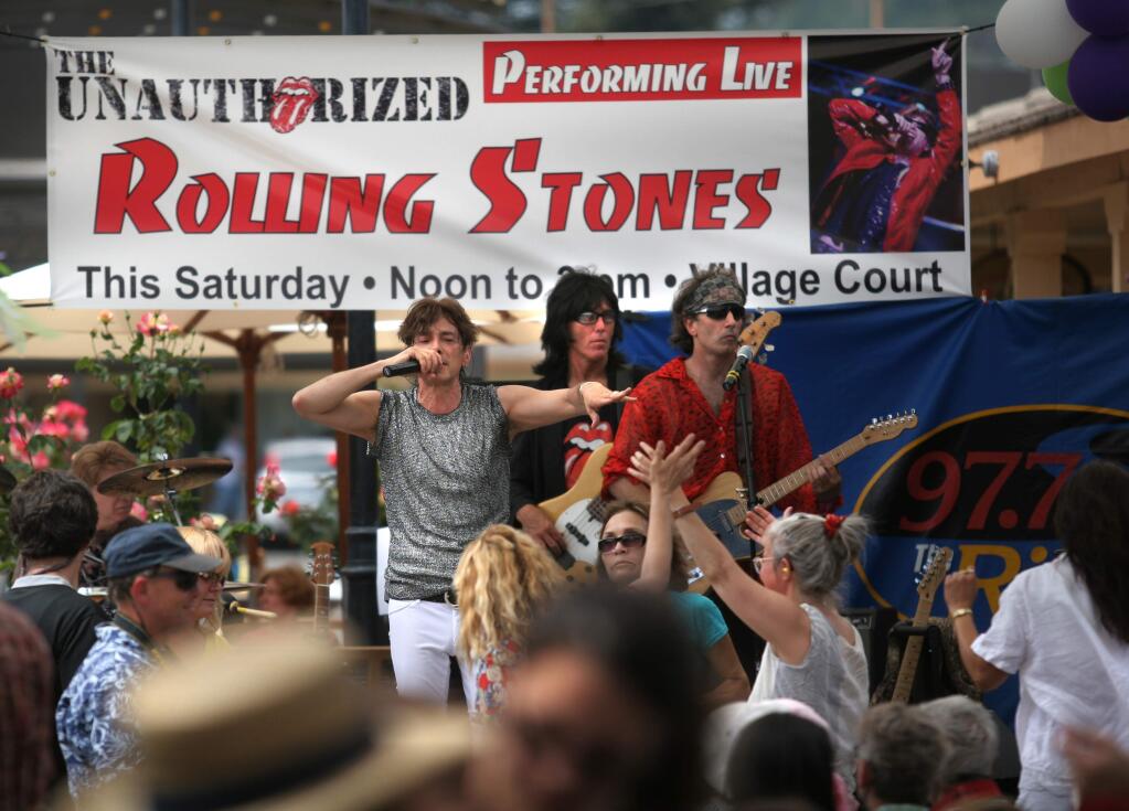 The Unauthorized Rolling Stones, with Rudy Colombini as Mick Jagger, played outdoors at Montgomery Village Saturday, June 20 to a crowd young and not-so-young stopping to listen in the usually-quieter shopping center courtyard.