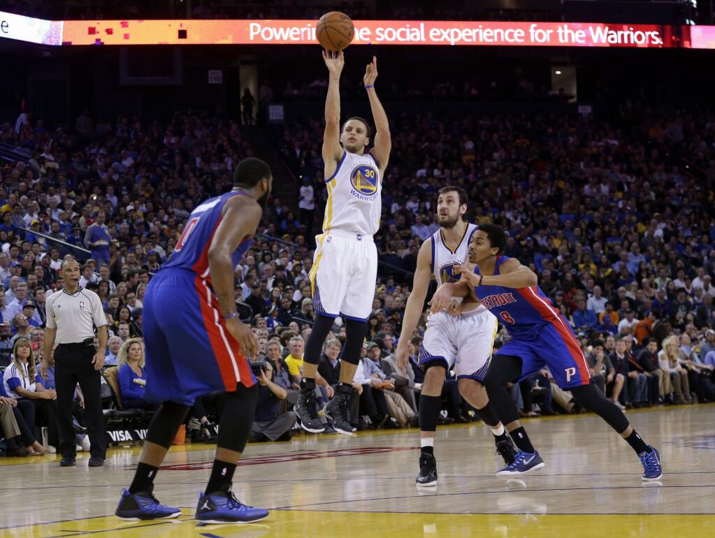 Golden State Warriors' Stephen Curry (30) shoots against the Detroit Pistons during the second half of an NBA basketball game Wednesday, March 11, 2015, in Oakland, Calif. Golden State won 105-98. (AP Photo/Marcio Jose Sanchez)