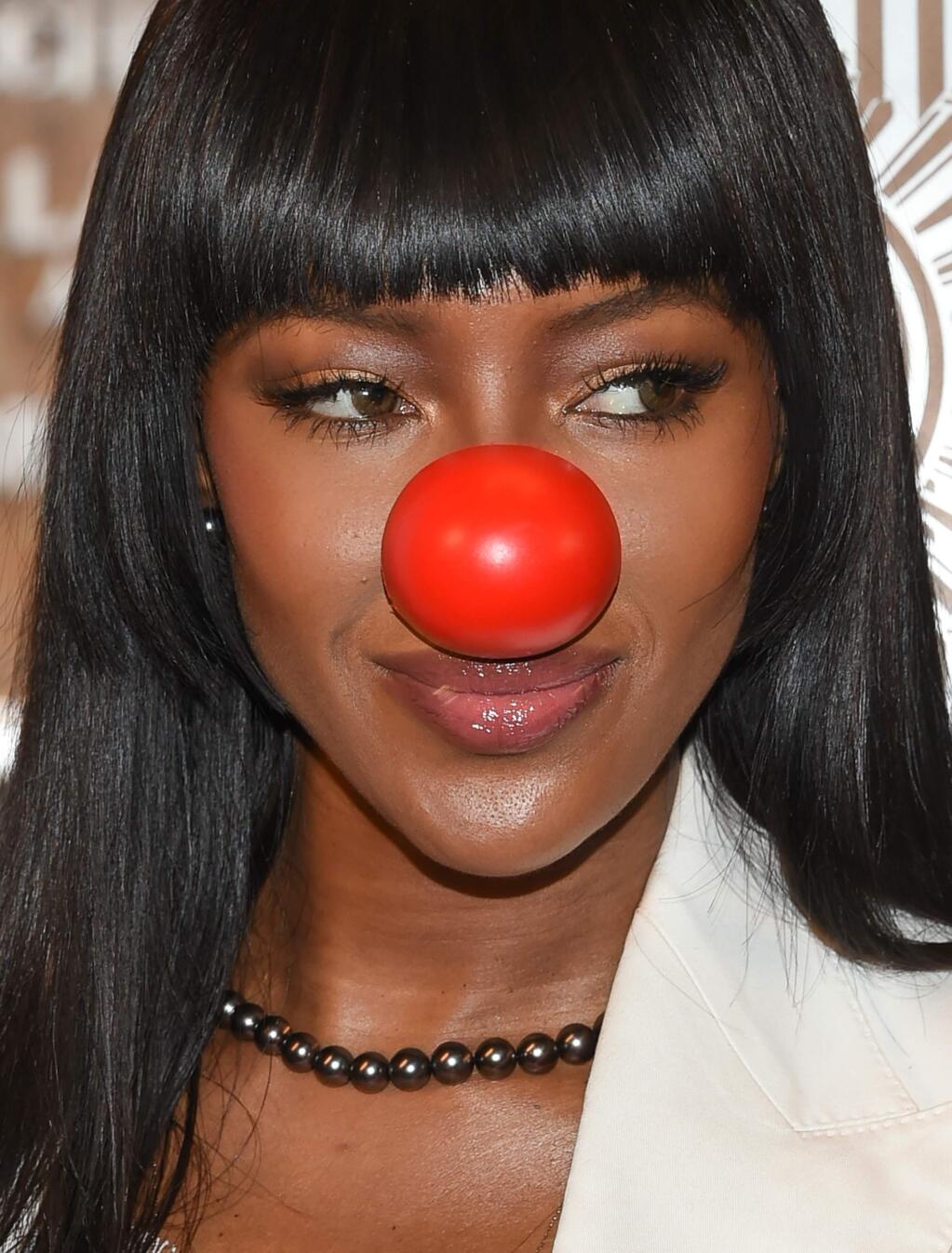 Model Naomi Campbell participates in the lighting the Empire State Building in honor of Red Nose Day on Tuesday, May 24, 2016, in New York. Red Nose Day is a national event to raise money and awareness for children in need. (Photo by Evan Agostini/Invision/AP)