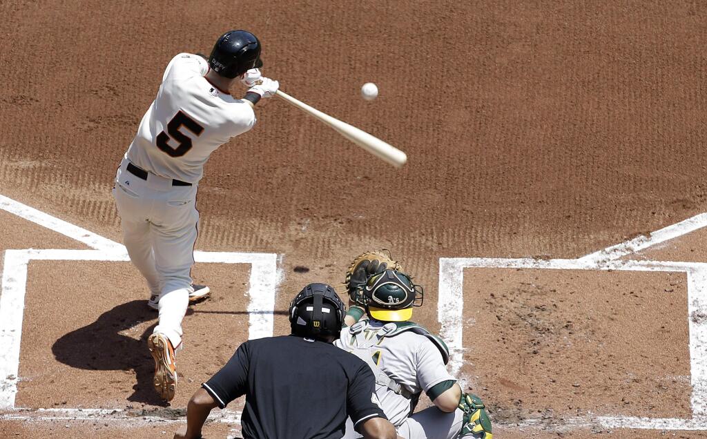 San Francisco Giants' Matt Duffy (5) hits a two-run home run off of Oakland Athletics pitcher Kendall Graveman during the first inning of a baseball game in San Francisco, Sunday, July 26, 2015. (AP Photo/Jeff Chiu)