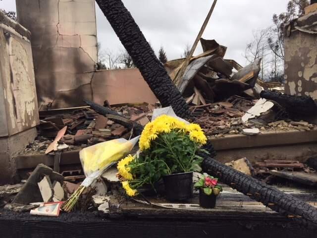 Flowers left at the Hanover Place home in Santa Rosa's Fountaingrove neighborhood where Tak-Fu Hung, 101, died in the Tubbs fire on Oct. 9, 2017. He was confirmed Thursday, Nov. 16 as one of 23 people killed in the fires in Sonoma County . (Courtesy photo)