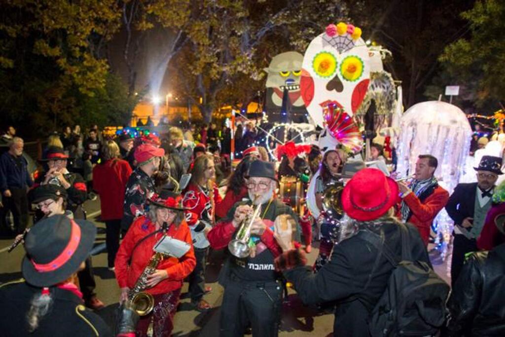 Parades of whimsically decorated and illuminated sofas will roll through the arts district streets with the colorful Hubbub Club marching band leading the merriment during Winterblast. (Tibidabo Photo Studio)