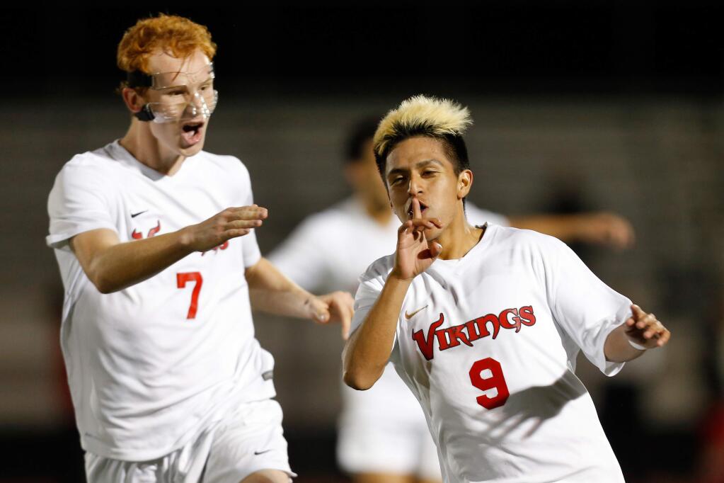 Montgomery's Alan Soto, right, and Ben Cawood celebrate after Soto scored the Vikings' first goal of the match during the second half of the CIF NorCal Division 1 quarterfinal boys soccer match between McClatchy and Montgomery high schools in Santa Rosa on Tuesday, March 6, 2018. (Alvin Jornada / The Press Democrat)