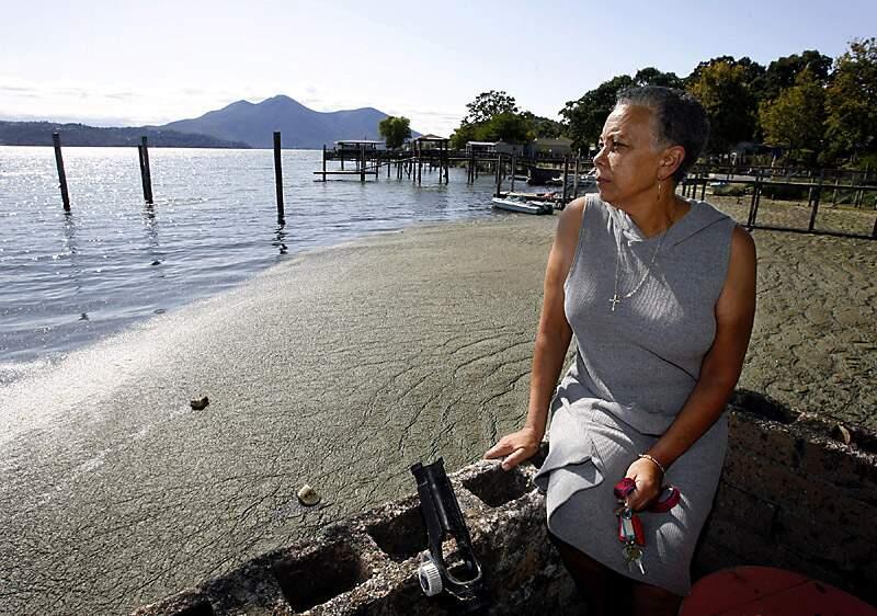 Dian Gibson, owner of Sunset Fishing Resort on Lakeshore Drive in Clear Lake has lost business since June 13th due to the foul odor emitted from the blue-green algae that has washed up into the cul de sac of her property. The Lake County Environmental Health department has posted warnings that the high levels of blue-green algae can produce harmful toxins.