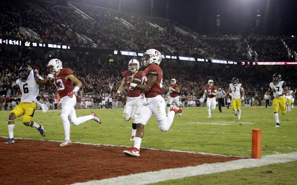 Stanford running back Bryce Love (20) scores a touchdown on a 48-yard run during the second half of an NCAA college football game against California, Saturday, Nov. 21, 2015, in Stanford, Calif. (AP Photo/Marcio Jose Sanchez)