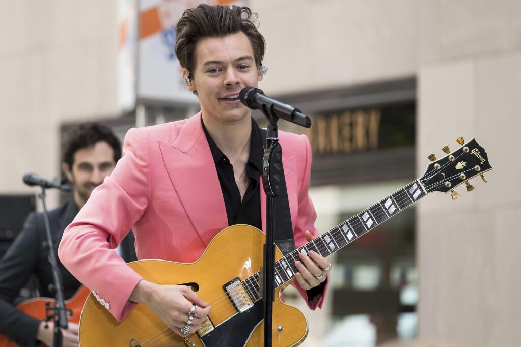 FILE - In this May 9, 2017, file photo, Harry Styles performs on NBC's 'Today' show at Rockefeller Plaza in New York. Styles took over hosting from James Corden for a portion of CBS' 'Late Late Show' on May 16, 2017. (Photo by Charles Sykes/Invision/AP, File)