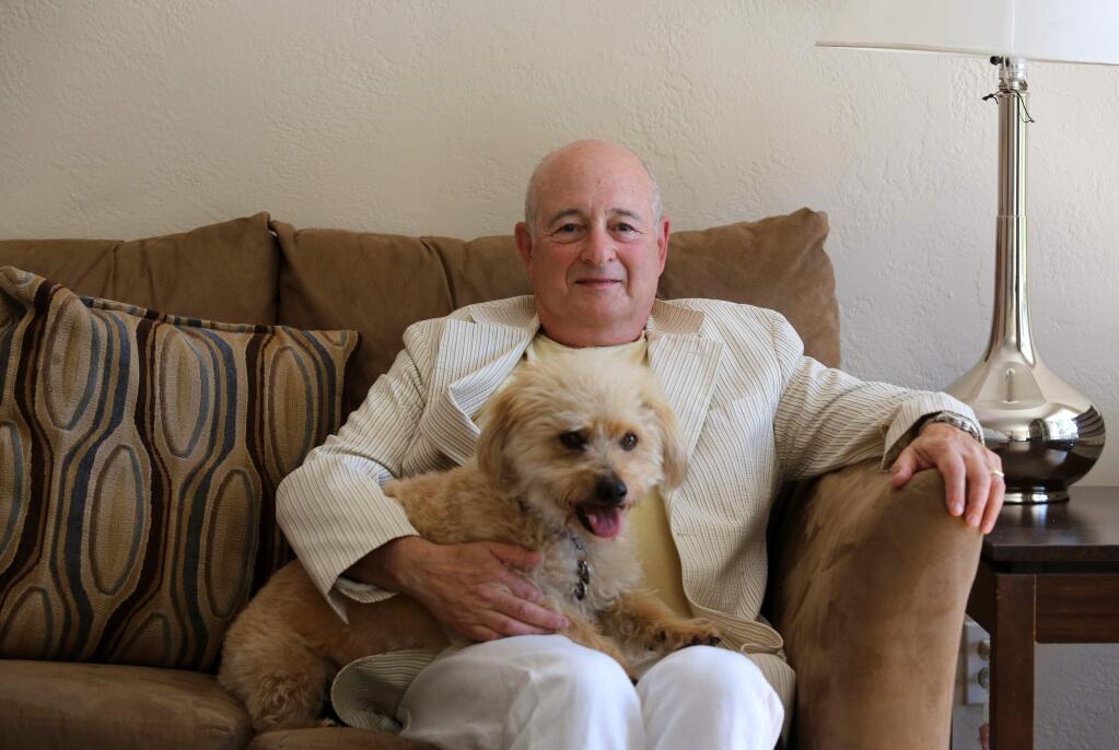 PHOTO: 1 BY CRISTA JEREMIASON/ THE PRESS DEMOCRAT -AT HOME: Joe Fineman with his dog Lollie earlier this month. Fineman says that as a retiree living in the eastern hills of Napa Valley, he is “happier than I've ever been.”