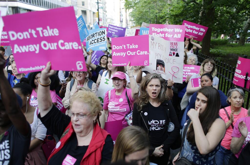 Supporters of Planned Parenthood at a rally Thursday in New York. (FRANK FRANKLIN II / Associated Press)