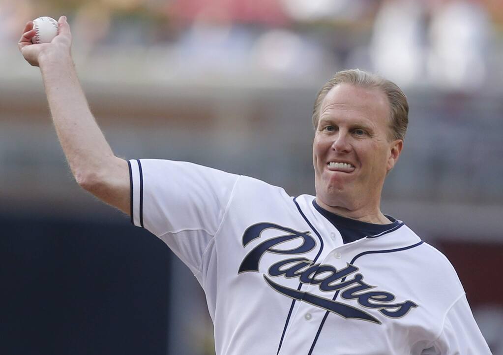 San Diego Mayor Kevin Faulconer throws out the ceremonial first pitch before the baseball game between the San Diego Padres and Detroit Tigers Saturday, April 12, 2014, in San Diego. (AP Photo/Lenny Ignelzi)