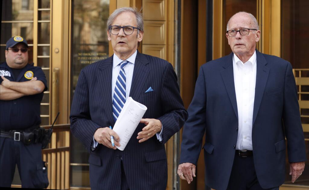 Former Rochester Drug Cooperative CEO Laurence Doud III, right, leaves US. District Court in Manhattan with his attorney Robert C. Gottlieb, Tuesday, April 23, 2019, in New York. The former head of a drug distributor has been indicted on what federal prosecutors say are the first-ever criminal charges against a drug company executive stemming from the opioid crisis. (AP Photo/Kathy Willens)