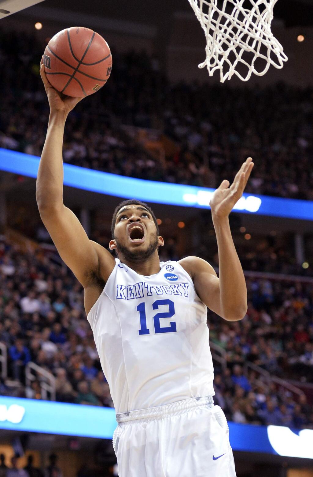 Kentucky's Karl-Anthony Towns shoots against Notre Dame during the first half of a college basketball game in the NCAA men's tournament regional finals, Saturday, March 28, 2015, in Cleveland. (AP Photo/David Richard)