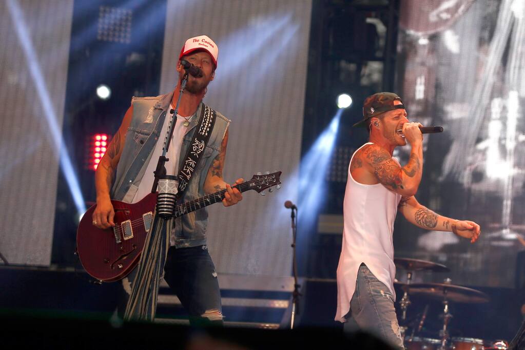 Country music duo Florida Georgia Line, Tyler Hubbard, left, and Brian Kelley, perform during the first day of the Country Summer Music Festival at Sonoma County Fairgrounds in Santa Rosa, California, on Friday, June 15, 2018. (Alvin Jornada / The Press Democrat)