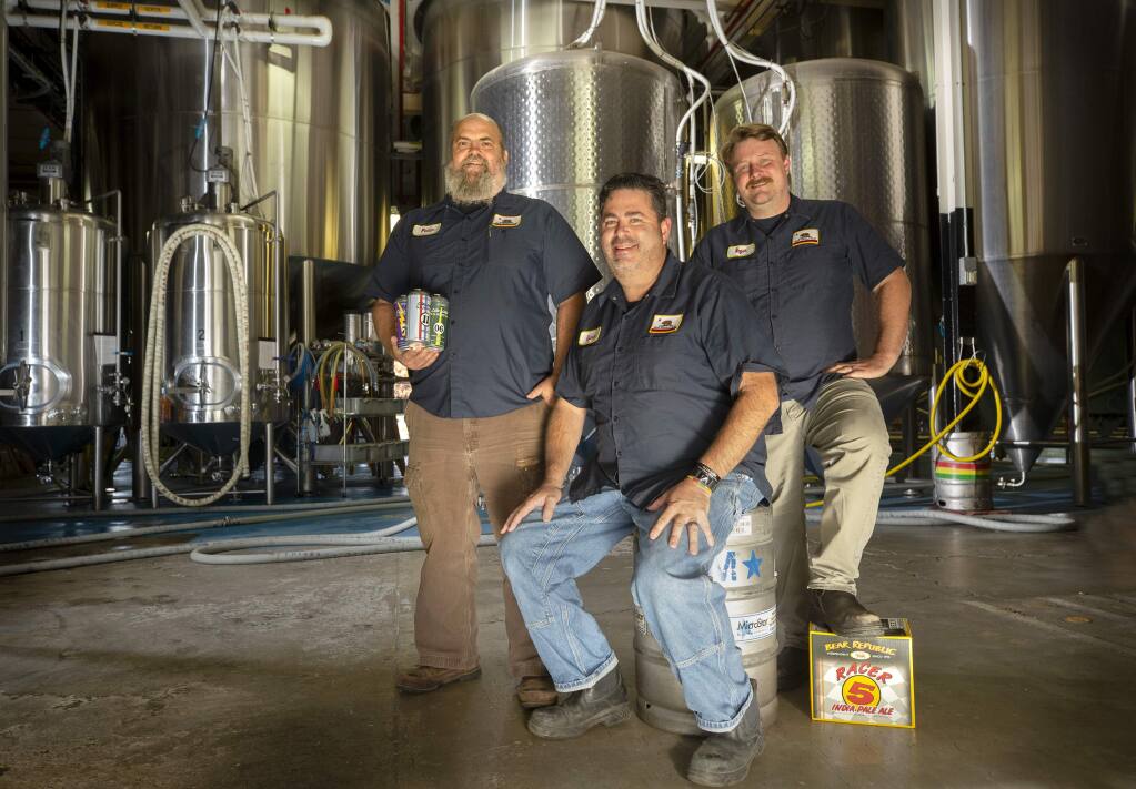 From left, Bear Republic COO Peter Kruger, CEO Richard Norgrove, and Brewmaster Roger Herpst inside their Cloverdale brewery. (photo by John Burgess/The Press Democrat)