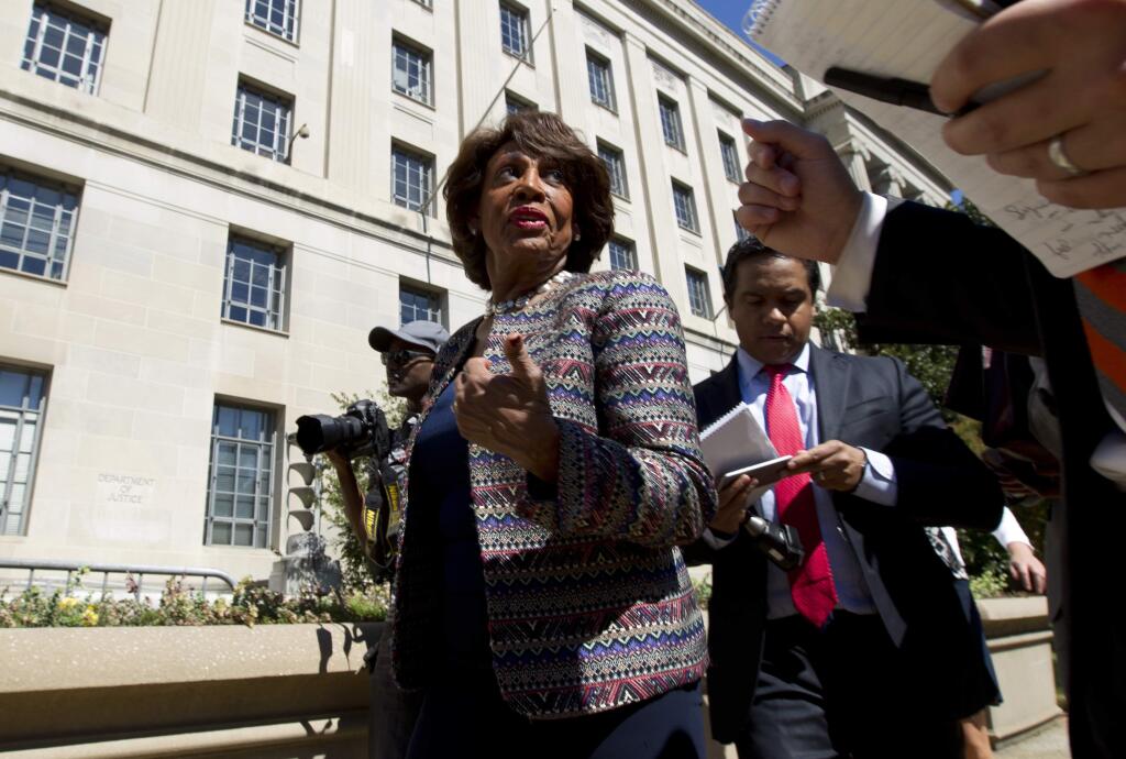 FILE - In this Sept. 22, 2016 file photo, Rep. Maxine Waters D-Calif., accompanied by other members of the Congressional Black Caucus (CBC), speaks to the media outside of the Justice Department in Washington. Waters has served in Congress for a quarter-century. Now she's turned into the passionate voice of resistance against the Trump administration. (AP Photo/Jose Luis Magana, File)